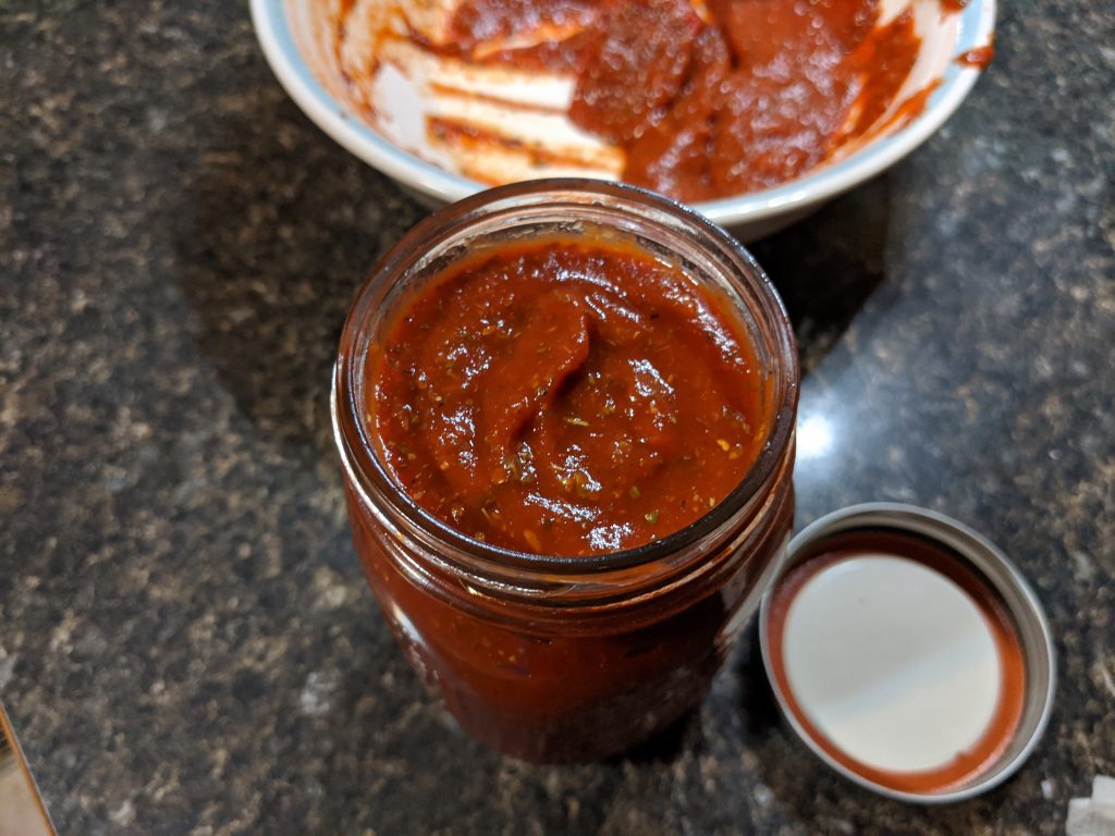 A jar of pizza sauce.