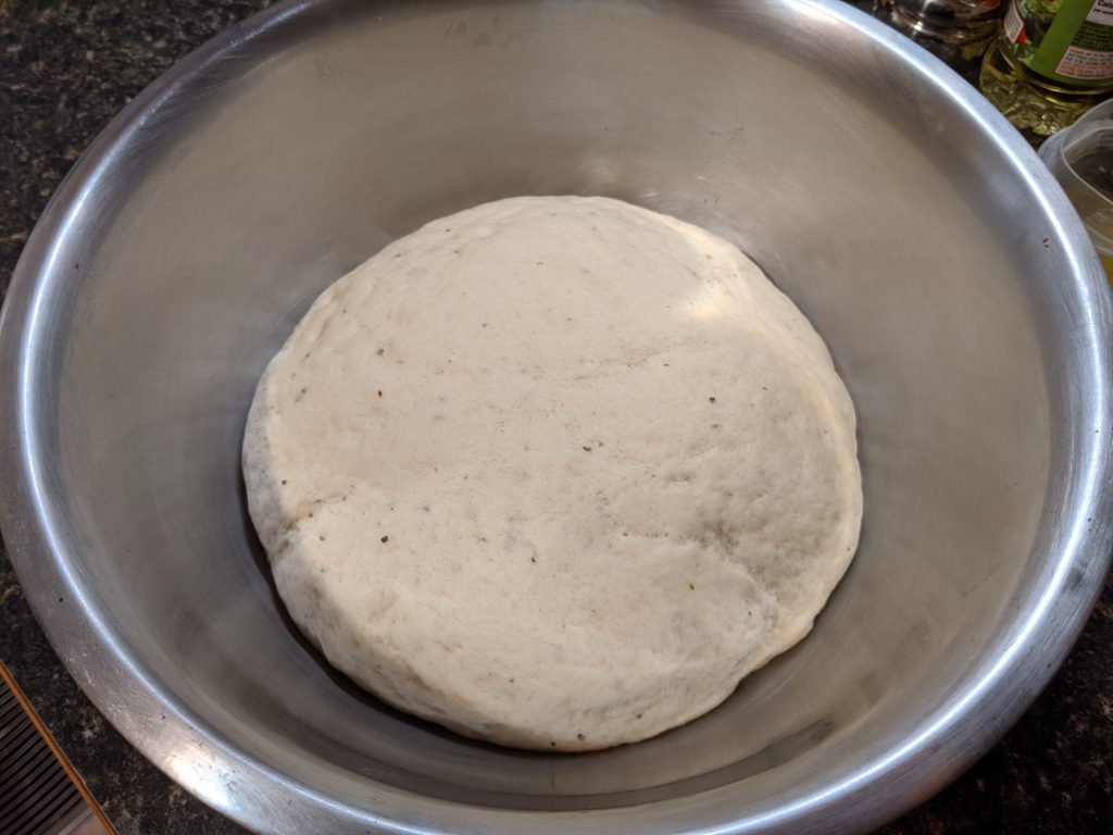 A ball of proofed pizza dough.