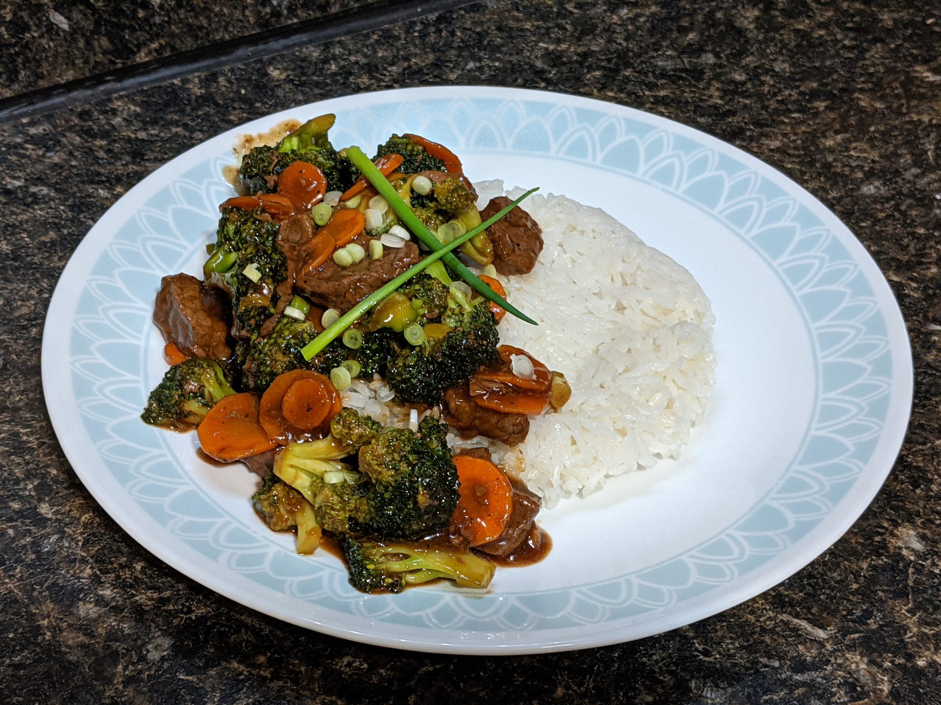 Beef and Broccoli with rice on a plate