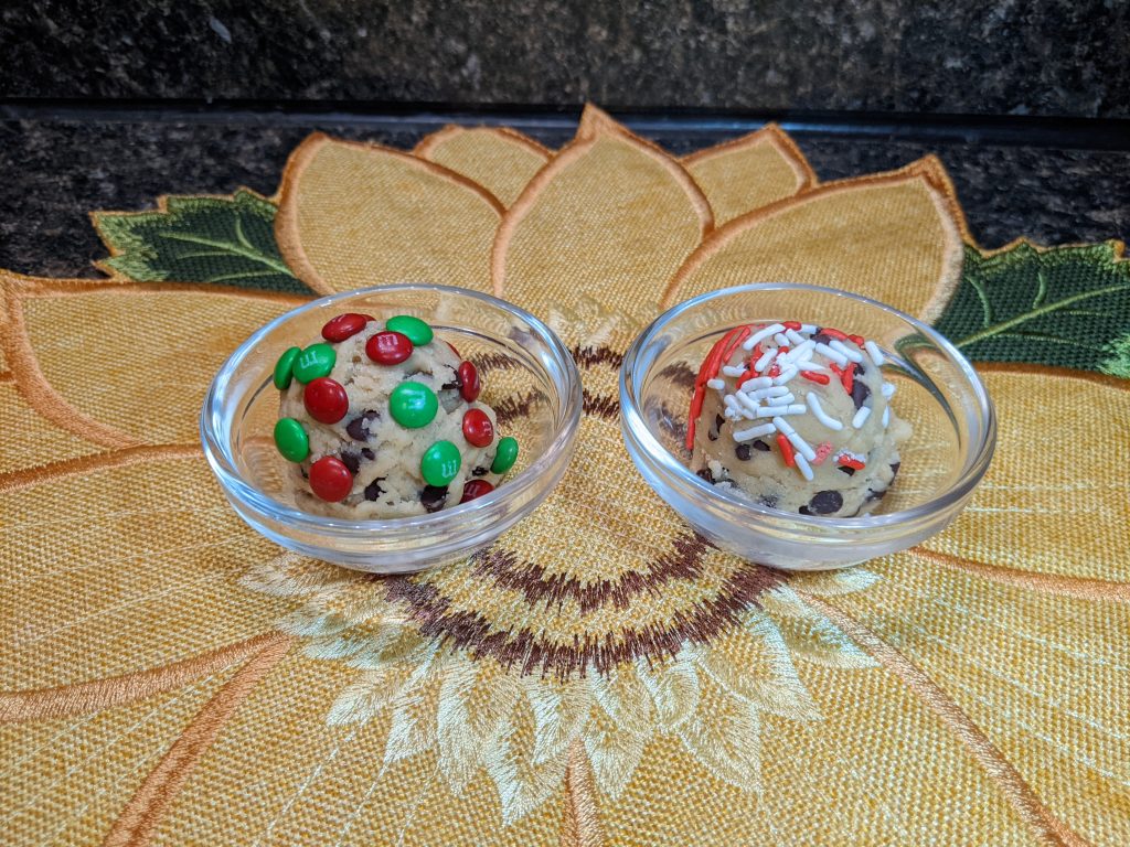 Two small bowls of edible cookie dough topped with sprinkles.